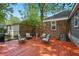 Relaxing backyard with a red painted deck, outdoor seating, and privacy fencing at 1124 Larosa Sw Ter, Atlanta, GA 30310