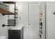 Bathroom features shelving, sleek fixtures, and a medicine cabinet for organized storage at 1124 Larosa Sw Ter, Atlanta, GA 30310