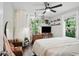Bright bedroom filled with plants, natural light, and a comfortable, inviting atmosphere at 1124 Larosa Sw Ter, Atlanta, GA 30310