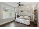 Serene bedroom with natural light, light curtains, and cozy, relaxing atmosphere at 1124 Larosa Sw Ter, Atlanta, GA 30310