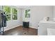 Bright laundry room with multiple windows, modern washer/dryer, and ample space for sorting at 1124 Larosa Sw Ter, Atlanta, GA 30310