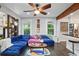 Spacious living room with a large blue sectional and a view into the kitchen, perfect for entertaining at 1124 Larosa Sw Ter, Atlanta, GA 30310