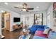 Stylish living room featuring a large sectional sofa with an open layout to other areas of the home at 1124 Larosa Sw Ter, Atlanta, GA 30310