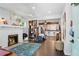Bright and airy living room featuring a fireplace and an open layout connecting to the kitchen at 1124 Larosa Sw Ter, Atlanta, GA 30310