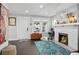 Well-lit living room with a decorative fireplace, hardwood floors, and an inviting, open atmosphere at 1124 Larosa Sw Ter, Atlanta, GA 30310