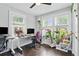 Bright office space with multiple windows, hardwood floors, and a comfortable workspace at 1124 Larosa Sw Ter, Atlanta, GA 30310