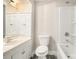 Bathroom featuring a white vanity, toilet, and shower with white walls at 1132 Luther Sw Dr, Mableton, GA 30126