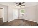 Cozy bedroom with a ceiling fan, closet, window, and hardwood flooring at 1132 Luther Sw Dr, Mableton, GA 30126