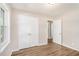 Bedroom featuring hardwood floors, double closet, and a large window at 1132 Luther Sw Dr, Mableton, GA 30126