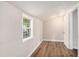 Bright bedroom with wood floors and a window at 1132 Luther Sw Dr, Mableton, GA 30126