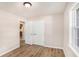 Bedroom featuring hardwood floors and double closet at 1132 Luther Sw Dr, Mableton, GA 30126