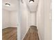 Hallway featuring hardwood floors and access to other rooms of the house at 1132 Luther Sw Dr, Mableton, GA 30126