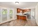 Bright kitchen featuring wood cabinets, stainless steel appliances, and granite countertops, creating a modern and functional space at 1132 Luther Sw Dr, Mableton, GA 30126