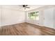 Bright living room with new flooring, picture window, and convenient front door access at 1132 Luther Sw Dr, Mableton, GA 30126