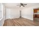 Spacious living room features new floors, fresh paint, and a modern ceiling fan at 1132 Luther Sw Dr, Mableton, GA 30126