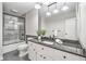 Bathroom with a sleek vanity, updated shower, and modern finishes at 3150 Rilman Nw Rd, Atlanta, GA 30327