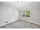 Neutral bedroom with a window offering plenty of natural light at 3150 Rilman Nw Rd, Atlanta, GA 30327