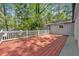 Spacious outdoor deck with natural tree shade and white railing at 3150 Rilman Nw Rd, Atlanta, GA 30327