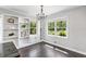 Dining room with dark floors, built in cabinets and shelves and windows at 3150 Rilman Nw Rd, Atlanta, GA 30327
