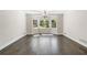 Dining room with bay window, dark hardwood floors and chandelier at 3150 Rilman Nw Rd, Atlanta, GA 30327