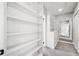 Hallway with built-in shelving, drawers, and neutral walls at 3150 Rilman Nw Rd, Atlanta, GA 30327