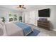 Main bedroom with ceiling fan, television, and outdoor access at 3150 Rilman Nw Rd, Atlanta, GA 30327