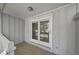 Covered patio space featuring tile flooring and glass sliding doors at 3150 Rilman Nw Rd, Atlanta, GA 30327