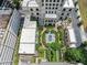Aerial view showcasing the building, its manicured gardens, and surrounding cityscape at 3376 Peachtree Ne Rd # 44B, Atlanta, GA 30326