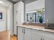 Stylish bar area with sleek white cabinets, modern fixtures, and elegant decor at 3376 Peachtree Ne Rd # 44B, Atlanta, GA 30326