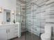 Modern bathroom featuring a glass-enclosed shower with marble tile and contemporary fixtures at 3376 Peachtree Ne Rd # 44B, Atlanta, GA 30326