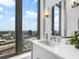 Bathroom with modern fixtures, a large window, and city views at 3376 Peachtree Ne Rd # 44B, Atlanta, GA 30326