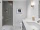 Modern bathroom with glass-enclosed shower and sleek white countertop at 3376 Peachtree Ne Rd # 44B, Atlanta, GA 30326