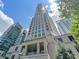 Stunning exterior shot of a high-rise building with architectural details and blue skies at 3376 Peachtree Ne Rd # 44B, Atlanta, GA 30326