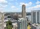 Expansive city view featuring numerous high-rise buildings against a blue sky with clouds at 3376 Peachtree Ne Rd # 44B, Atlanta, GA 30326