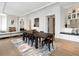 Open-concept dining area with fireplace, sleek furnishings, and a comfortable window seat at 3376 Peachtree Ne Rd # 44B, Atlanta, GA 30326