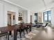 Elegant dining area featuring a large table, hardwood floors, and seamless integration with the living space at 3376 Peachtree Ne Rd # 44B, Atlanta, GA 30326