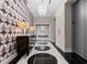 Elegant hallway featuring striking wallpaper, black and white marble floors, and modern lighting at 3376 Peachtree Ne Rd # 44B, Atlanta, GA 30326
