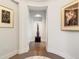 Elegant hallway featuring hardwood floors and sophisticated art adornments at 3376 Peachtree Ne Rd # 44B, Atlanta, GA 30326