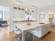 Open kitchen with stainless steel appliances, bar seating, and lots of natural light at 3376 Peachtree Ne Rd # 44B, Atlanta, GA 30326