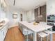Bright kitchen featuring an island, stainless steel appliances, and custom cabinetry at 3376 Peachtree Ne Rd # 44B, Atlanta, GA 30326