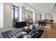 Spacious living room with modern decor, floor-to-ceiling windows, and hardwood floors at 3376 Peachtree Ne Rd # 44B, Atlanta, GA 30326