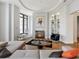 Inviting living room featuring a marble fireplace, modern decor, and expansive windows with city views at 3376 Peachtree Ne Rd # 44B, Atlanta, GA 30326