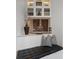 Inviting window seat with black cushions, built-in shelving, and decor at 3376 Peachtree Ne Rd # 44B, Atlanta, GA 30326