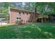 Large green backyard, with deck and red brick home at 486 Edward Ct, Marietta, GA 30066