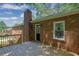 Side view of backyard deck and red brick home at 486 Edward Ct, Marietta, GA 30066