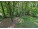 Secluded backyard features mature trees and a fence, offering a private outdoor space at 486 Edward Ct, Marietta, GA 30066