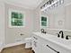 Bathroom features a double vanity, modern lighting, and stylish fixtures at 486 Edward Ct, Marietta, GA 30066