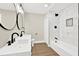 Modern bathroom featuring double sink vanity and tub shower with black fixtures at 486 Edward Ct, Marietta, GA 30066