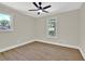 Neutral bedroom featuring ceiling fan, hardwood flooring, and double windows at 486 Edward Ct, Marietta, GA 30066