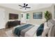 Bedroom offering a ceiling fan, window views, decorative plant, and a comfortable sleeping area at 486 Edward Ct, Marietta, GA 30066